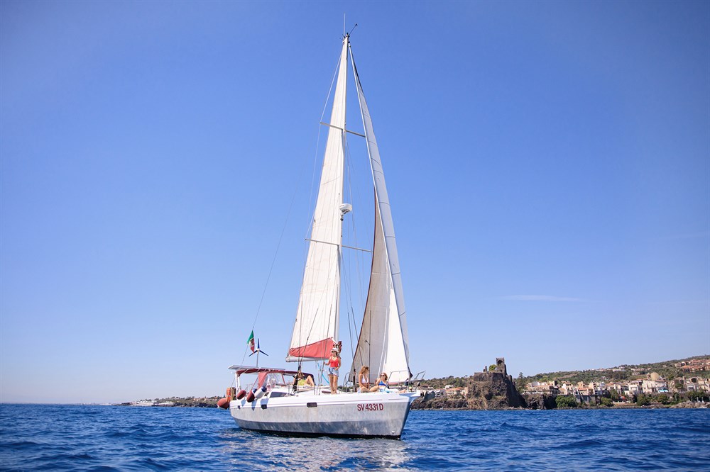 img:https://www.thethinkingtraveller.com/media/Resized/SICILY%20local%20areas/Taormina_and_beaches/Namaste_boat_trip_SEP20/1000/TTT_Sicily_boat_trip_Namaste_Aci_castello_AUG20_0418.jpg
